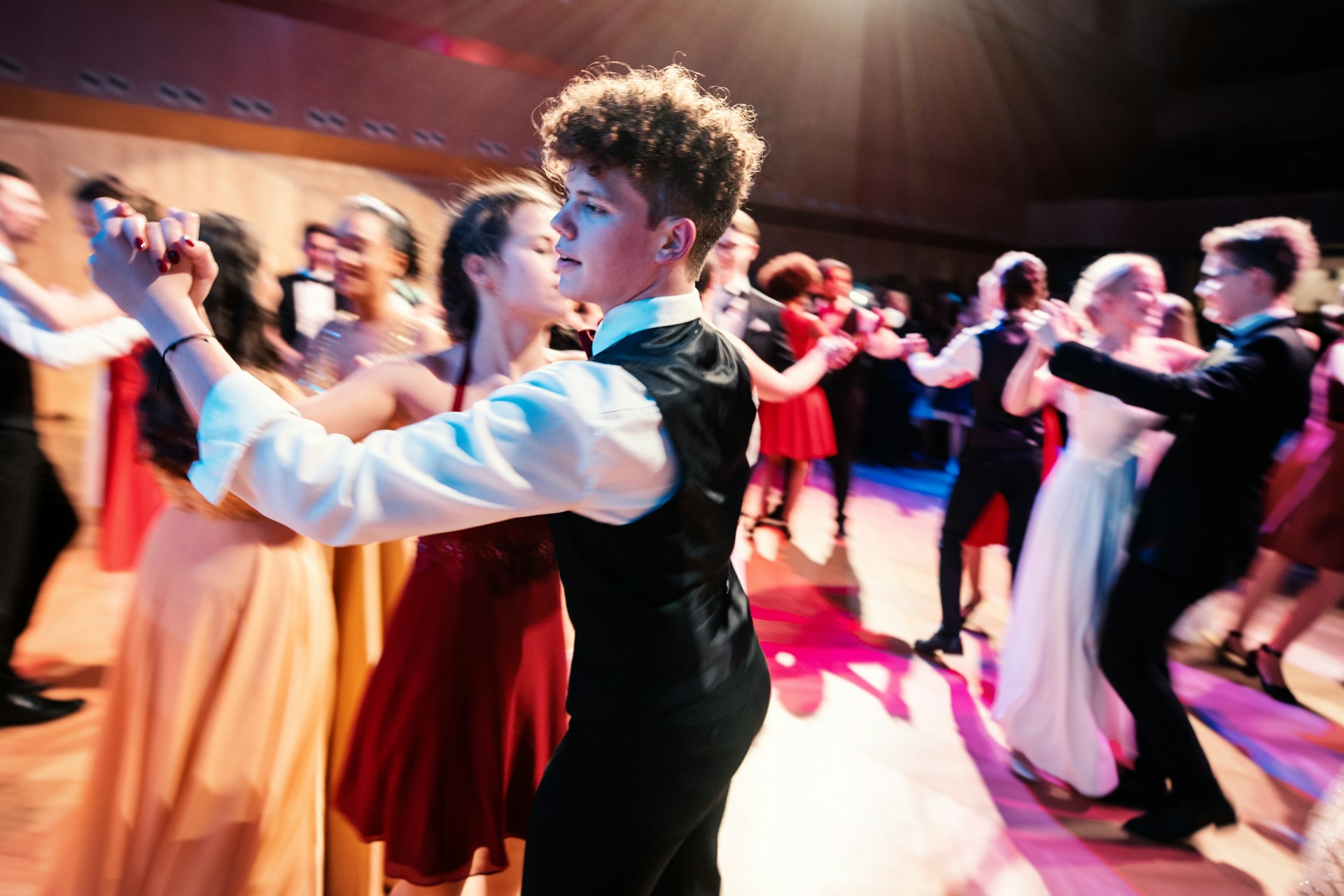 Young people dancing on the dance floor | Source: Unsplash